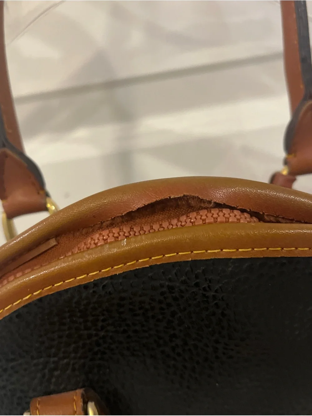 Dooney & Bourke Black with Brown Trim Pebbled Leather Satchel